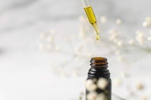oil being dopped into small bottle